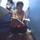 An Eastern-European woman desperately sits down on a toilet and takes a shit with sloppy, wet gurgling sounds. She reads a magazine while trying to push out more. Presented in 720P HD, however, video quality is somewhat dark and grainy. About 10 minutes.